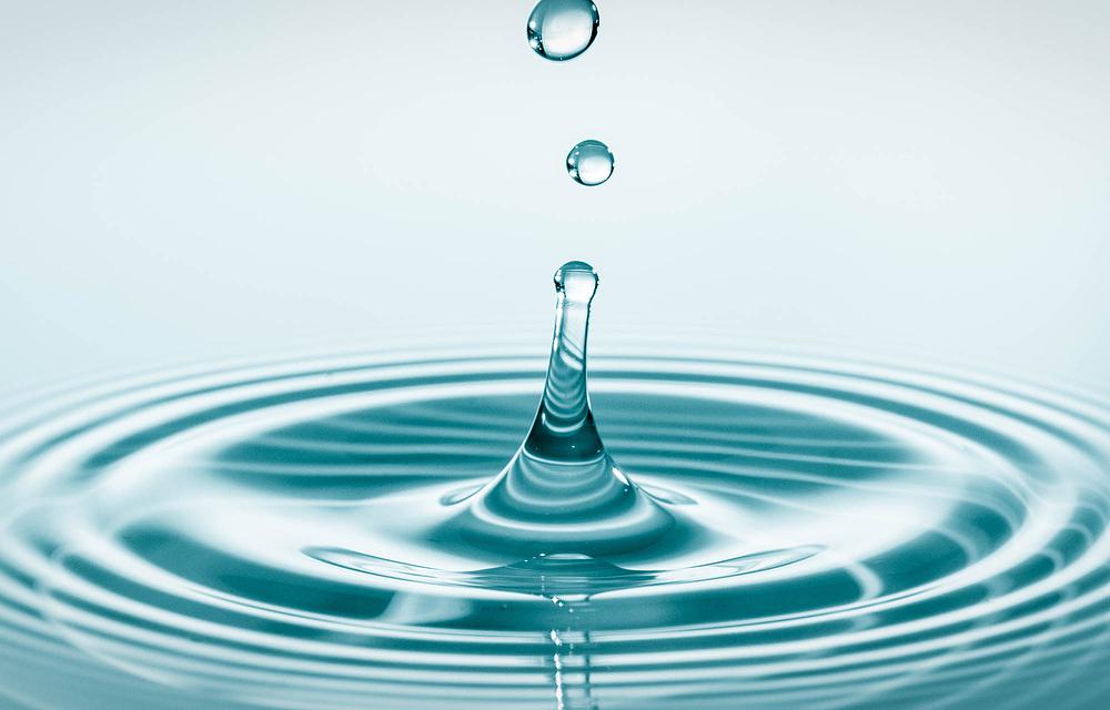 Water Drop Falling And Drips On Water Mirror. Water Drop Splash
