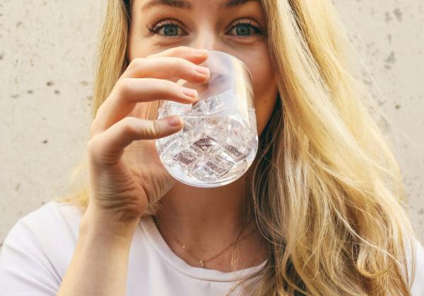 Young lady drinking a glass of water