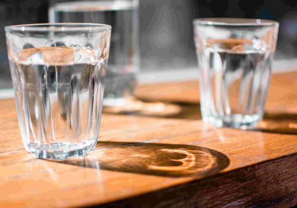 Glasses of water filled from a water filter cooler in Geelong office